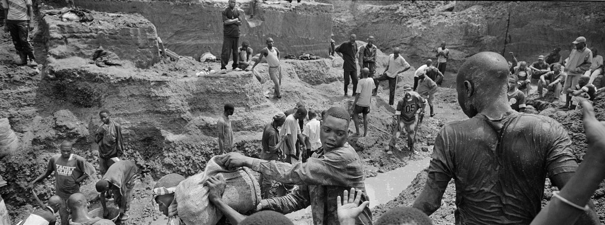 Men work in an open-pit mine, monitored byarmed guards. Production runs for 24 hours aday, in two twelve-hour shifts