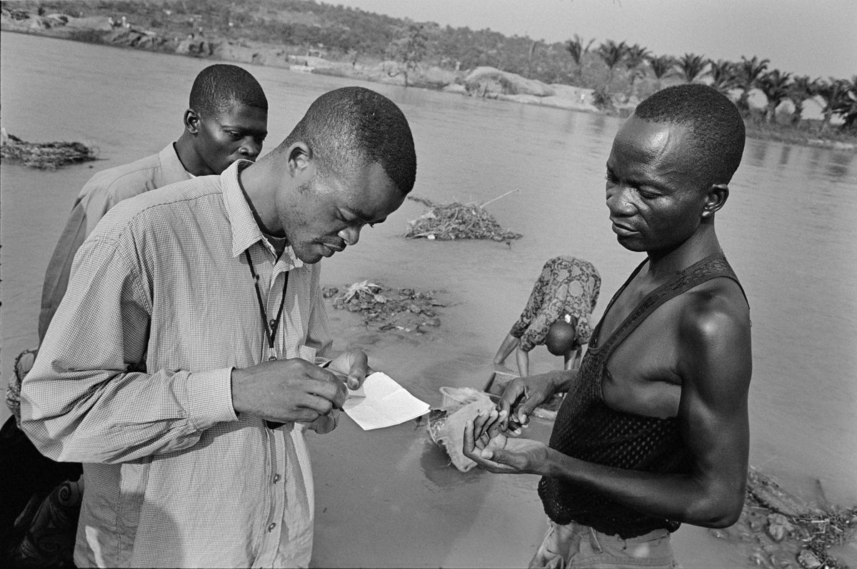 Diamond buyer at the river in Mbuji-Mayi, DRCongo.
