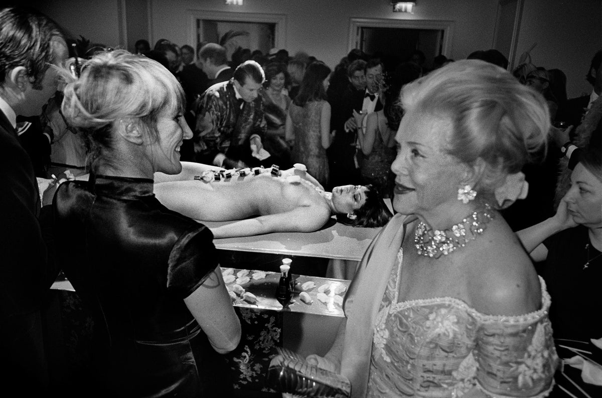 Woman wearing diamonds at a society party inLondon.