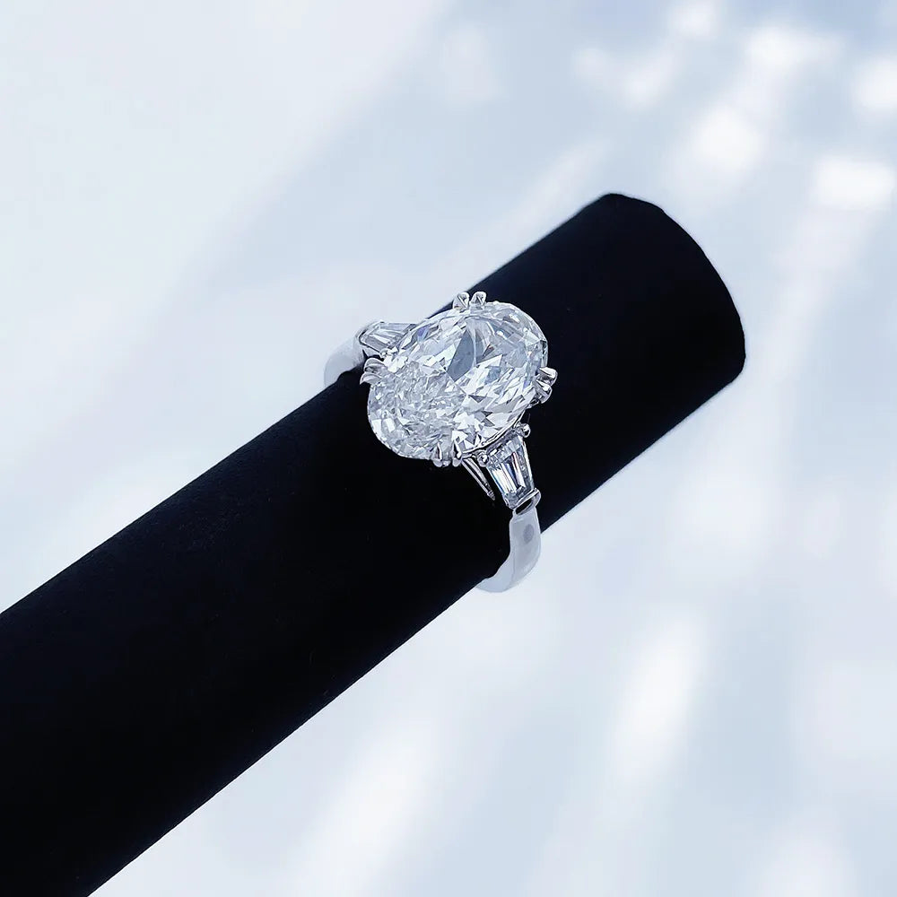 2.24 ct Four-Prong Oval-Cut Lab-Grown Diamond Three-Stone Ring in PT950 Platinum