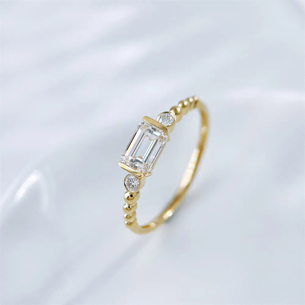 0.78 ct Emerald-Cut Lab-Grown Diamond Three-Stone Ring in 18K Yellow Gold