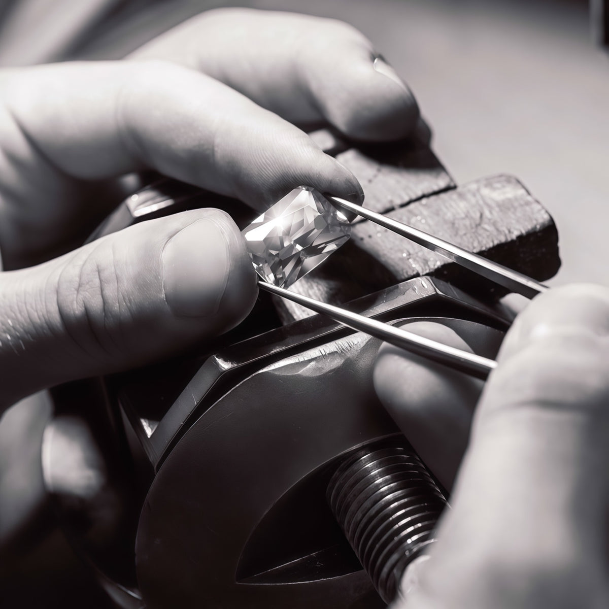 A jeweler precisely positioning a diamond with specialist tools.